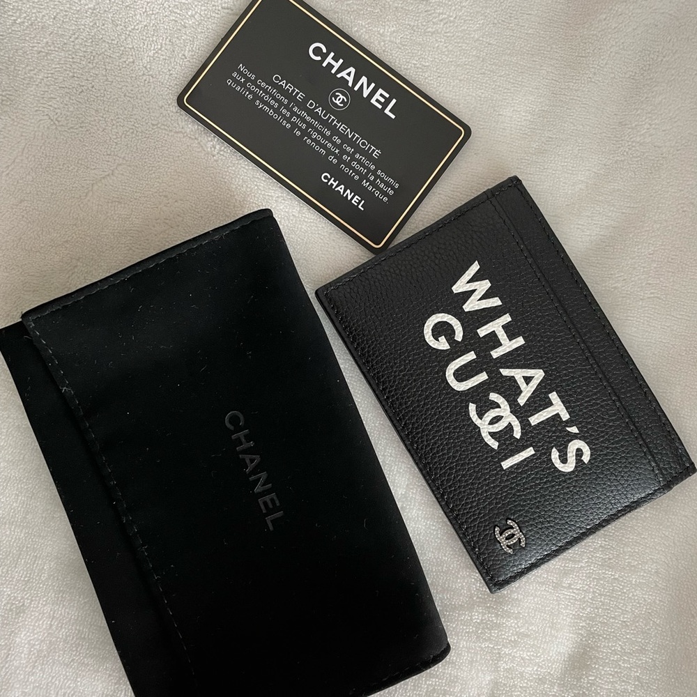 Black leather Chanel 3 slot cardholder.